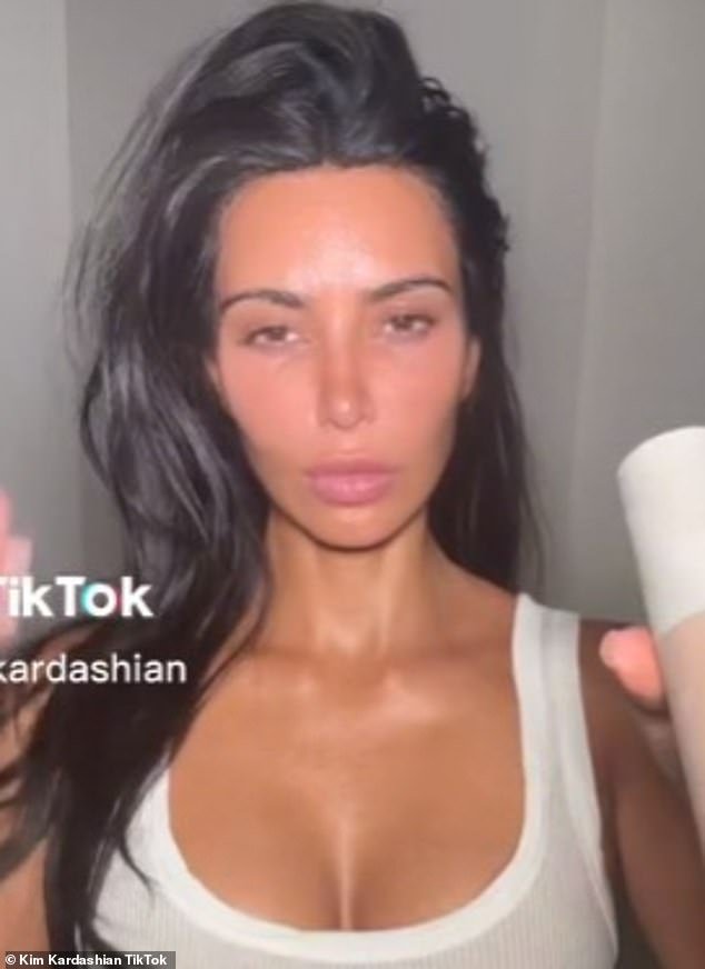 Is that you Kimmy?  Kim Kardashian looked very different in her TikTok clip from Monday.  The mermaid, 42, was wearing her SKKN skincare brand of hers as she looked busty in a white tank top that showed off her cleavage.