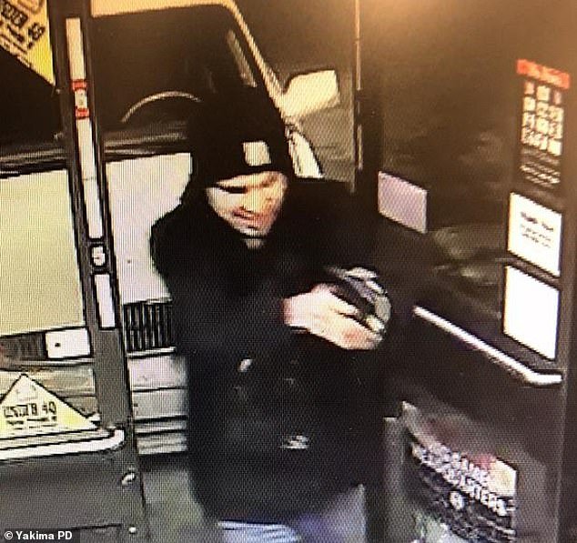 Jarid Haddock, 21, was identified by police as the suspect after the attack at the Circle K store in Yakima, about 110 miles southeast of Seattle, at 3:30 a.m. Tuesday.  Photos released by the police department showed the suspect inside the store brandishing a handgun.
