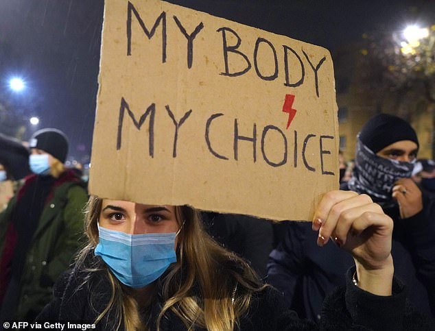 Pictured: A woman takes part in a protest in 2020 against tighter abortion laws in Poland