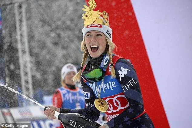 Mikaela Shiffrin of the United States celebrates on the podium after winning an alpine skiing, Women's World Cup giant slalom, at Kronplatz, Italy on Tuesday.