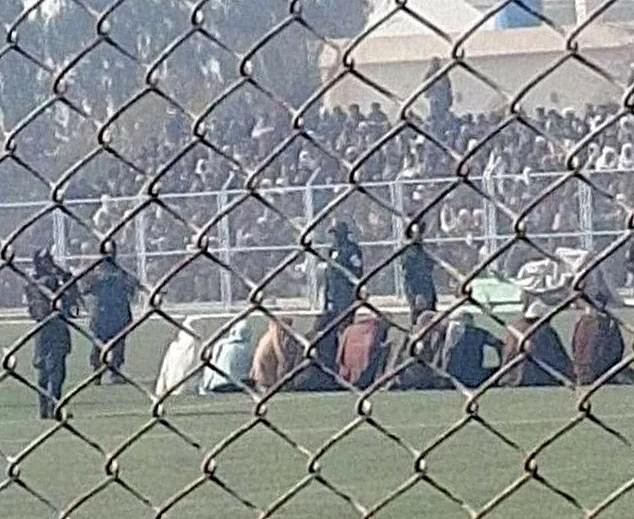 The Taliban has viciously flogged nine men during a public show trial in a packed football stadium