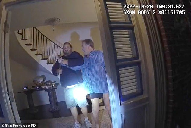 The video shows two police officers arriving at Pelosi's house, knocking on the door, and waiting about 20 seconds before they answer.