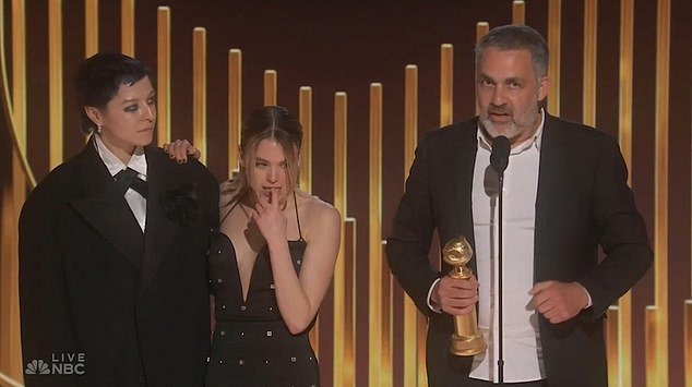 'She's drunk as HELL!'  Milly Alcock (center of photo) set Twitter on fire this week thanks to her drunken appearance on stage at the Golden Globes.