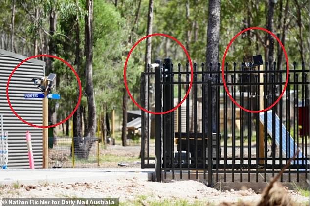 The front fence of the property is packed with security cameras that focus on the road and have 360 ​​degree rotation capability on the grounds that looks like a military style camp.