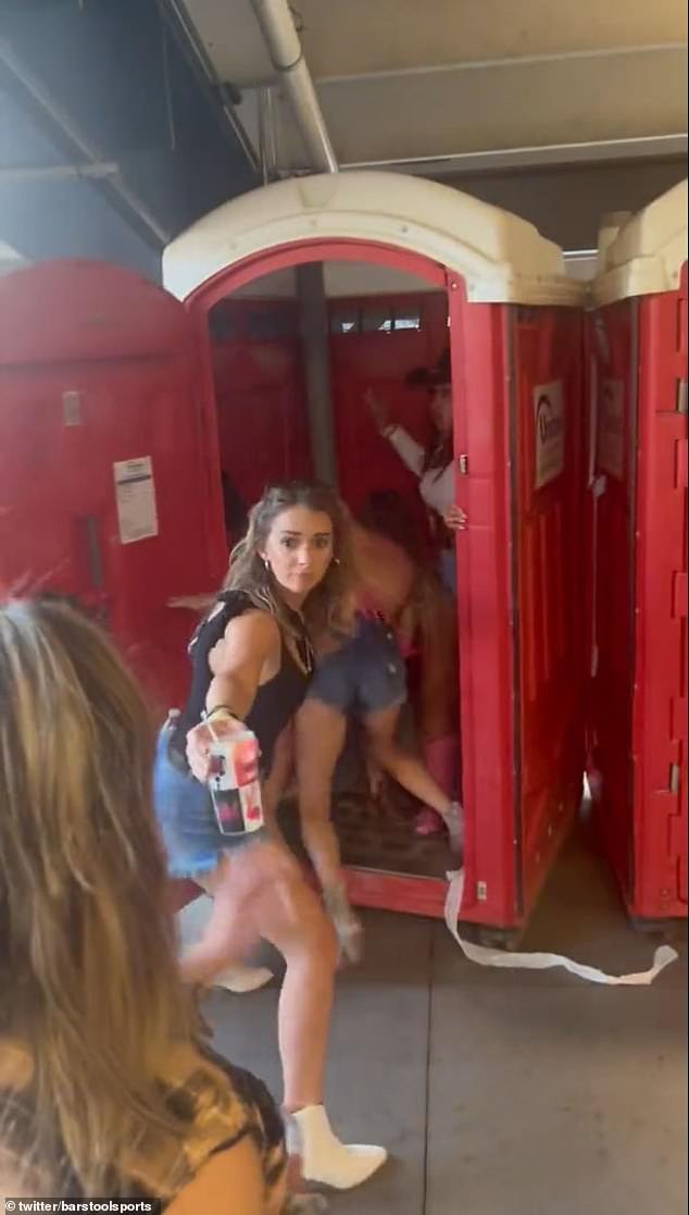 Another woman then joins the fight as it enters one of the toilets, as they now pin the other woman down.