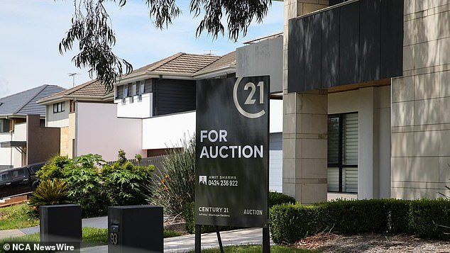 The affordability situation is grim in NSW, where a normal-income household can afford just seven per cent of homes sold in the state (pictured: A Sydney house being auctioned)