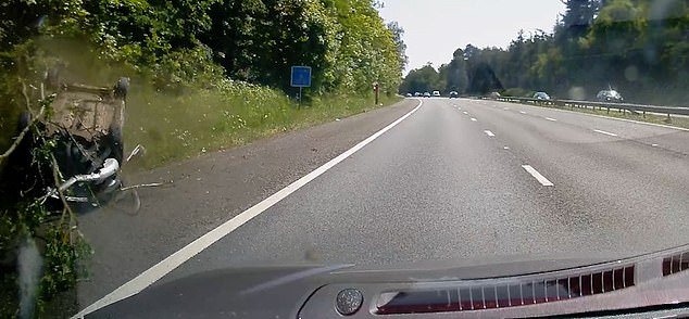 The entire incident was captured on dramatic dash cam footage showing the car on the roof near the hard shoulder