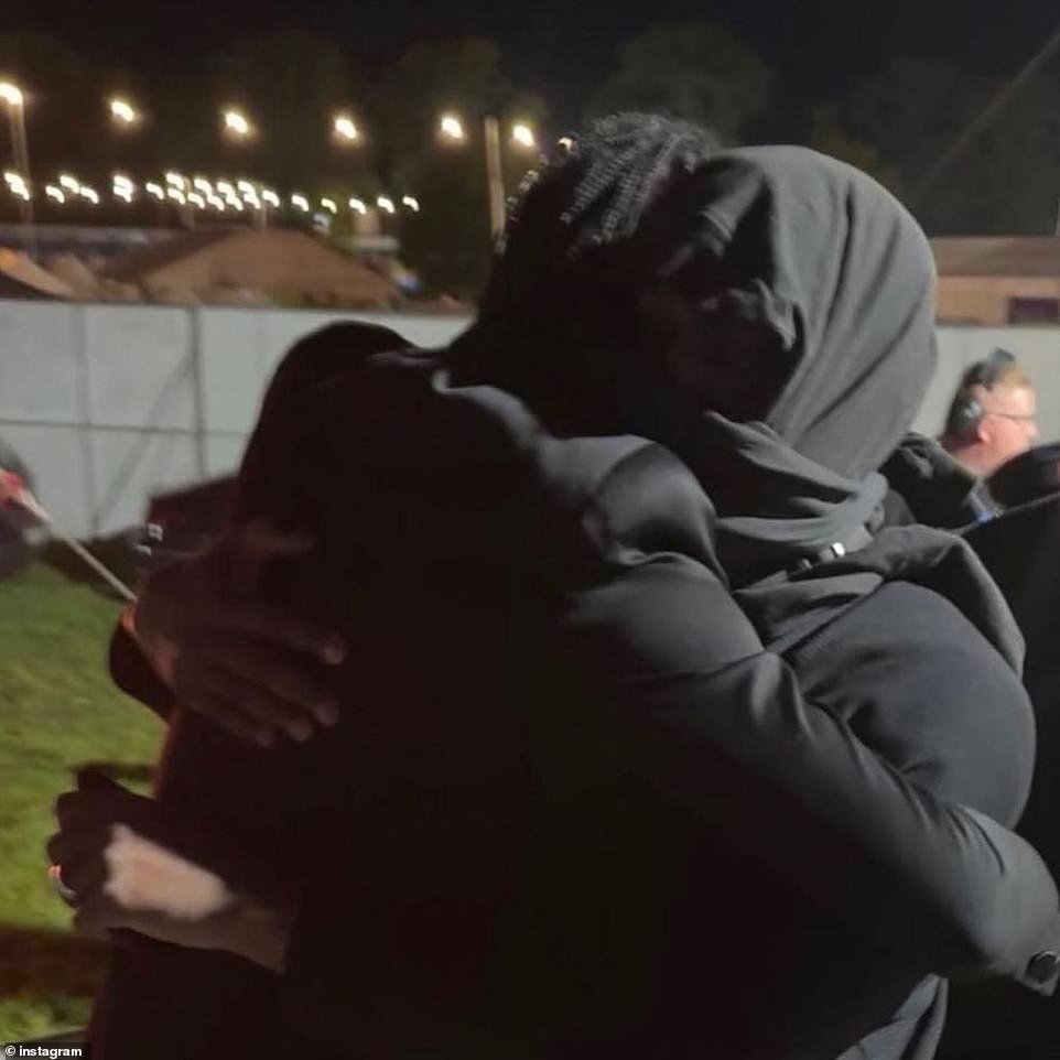 Cuddle: Kanye attended the Electric Picnic Festival in County Laois and was captured in this photo hugging pal Steve Lacy.  The Dark Red singer is one of the artists performing at the festival