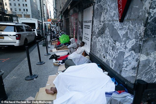 Migrants were seen sleeping outside the Roosevelt Hotel, which has reached capacity since being converted into a designated center for asylum seekers