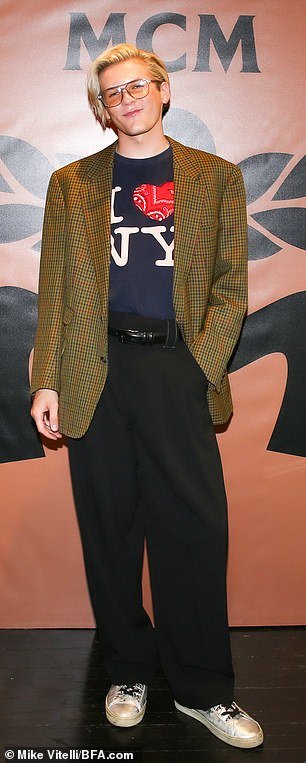 Menswear: TikTok star Davis Burleson wore a brown blazer over a T-shirt and black trousers