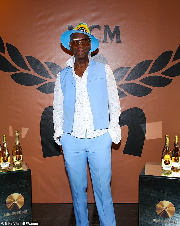 Feeling blue: Fashion designer Dapper Dan, 79, showed off his groovy style in a baby blue hat, cardigan and trousers