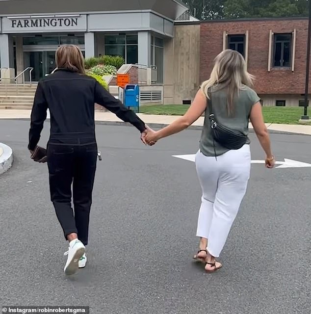 Roberts, 62, and Laign, 49, smiled and held hands as they walked into the Farmington County Clerk's Office in Connecticut