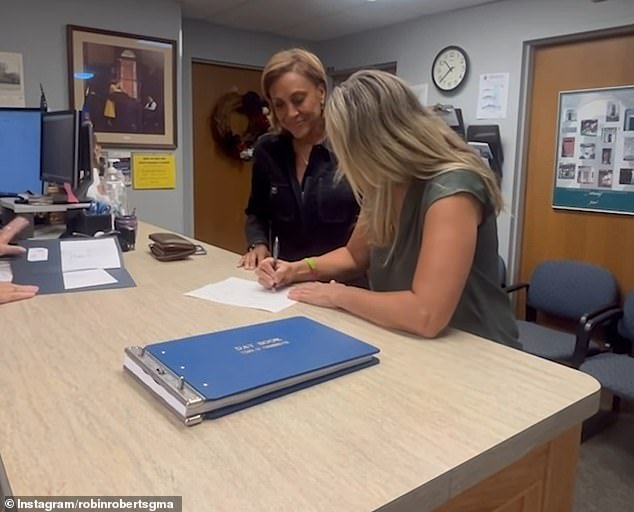 Roberts was the first to sign the paperwork, followed by Laign, who takes her future wife's name.  