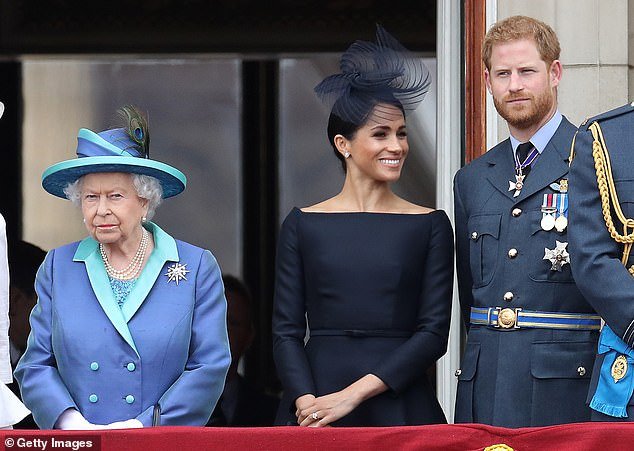 Meghan looks pleased in this photo from the balcony of Buckingham Palace.  Her Majesty, the Queen, to a lesser extent... They gathered to mark the 100th anniversary of the Royal Air Force in 2018