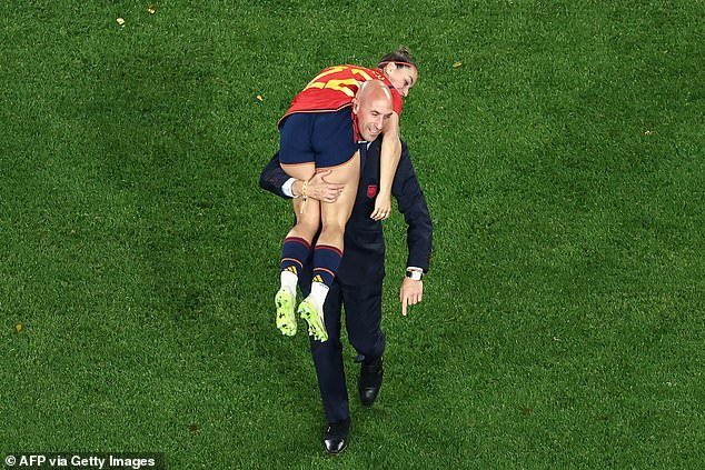 In this photo taken on August 20, 2023, Royal Spanish Football Association president Luis Rubiales can be seen carrying Spain's Athenea del Castillo Beivid on his shoulder as she celebrates Australia's and Women's World Cup finals win New Zealand 2023 between Spain and England celebrating at Stadium Australia in Sydney