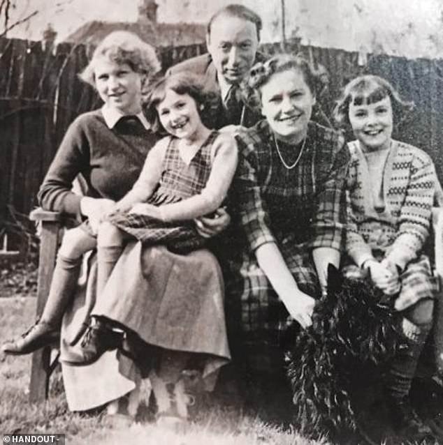 Her parents moved from London to Berkhamsted, Hertfordshire, in 1939.  Pictured: Esther (far right) with her parents (center) and sister (second from left)