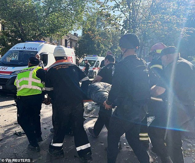 Rescuers and police officers carry a person freed from rubble at a site of a Russian missile strike, amid the Russian attack on Ukraine, in Kryvyi Rih, Dnipropetrovsk region, Ukraine, September 8, 2023