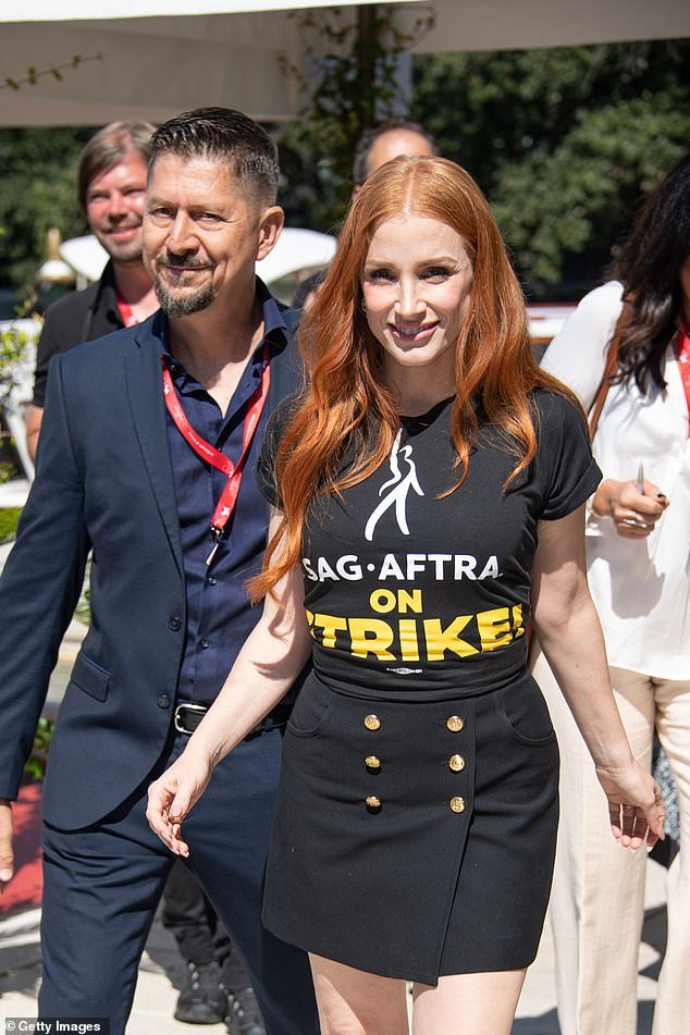 Out and about: The 46-year-old Interstellar star was spotted wearing the T-shirt at the 80th annual festival on Friday, attending safely in the knowledge she wasn't crossing the picket line