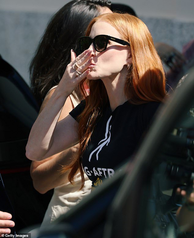 Kisses!  She blew kisses as she landed in her statement T-shirt