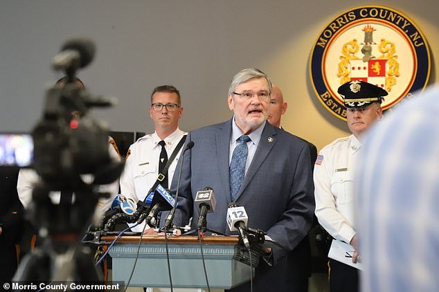 Morris County Prosecutor Robert Caroll (pictured) made the stunning announcement during a news conference Thursday that the parents have been identified and an arrest has been made.