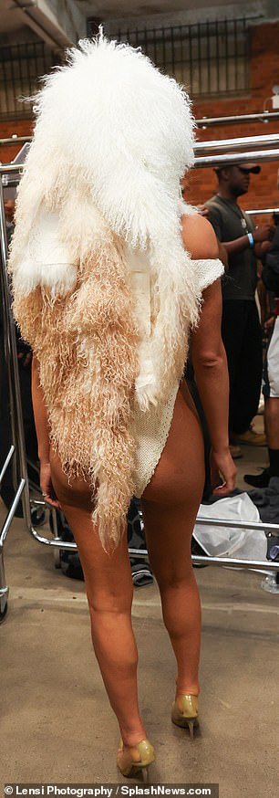 Passion for fashion: Despite being more covered up than her more recent outings, she still managed to show off her stunning figure in a figure-hugging white crochet bodysuit