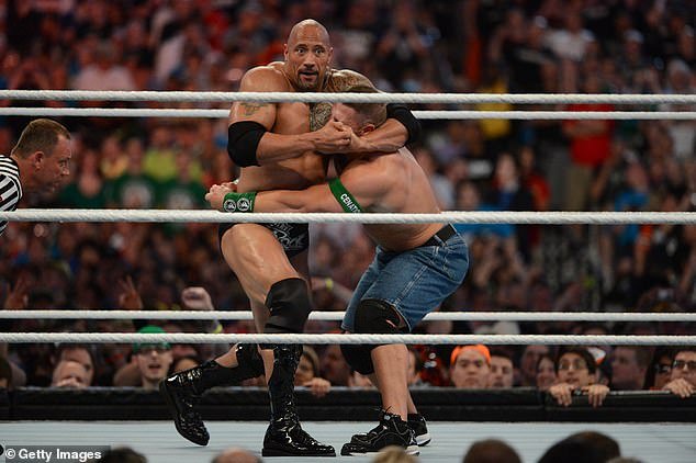 He famously battled Cena at WrestleMania in 2012 (pictured) and 2013
