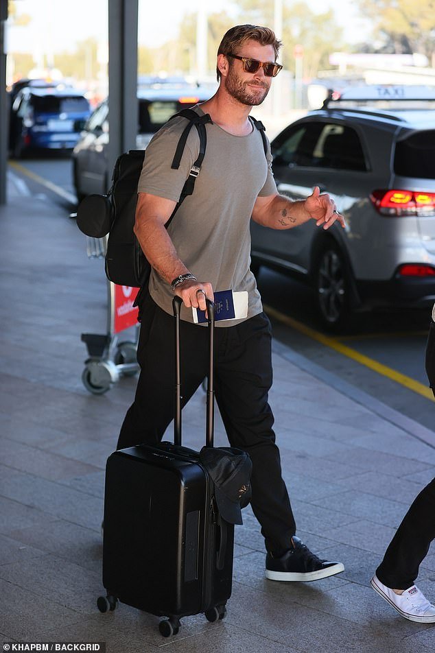 With a backpack strapped to his torso, the movie star wheeled past his other suitcase
