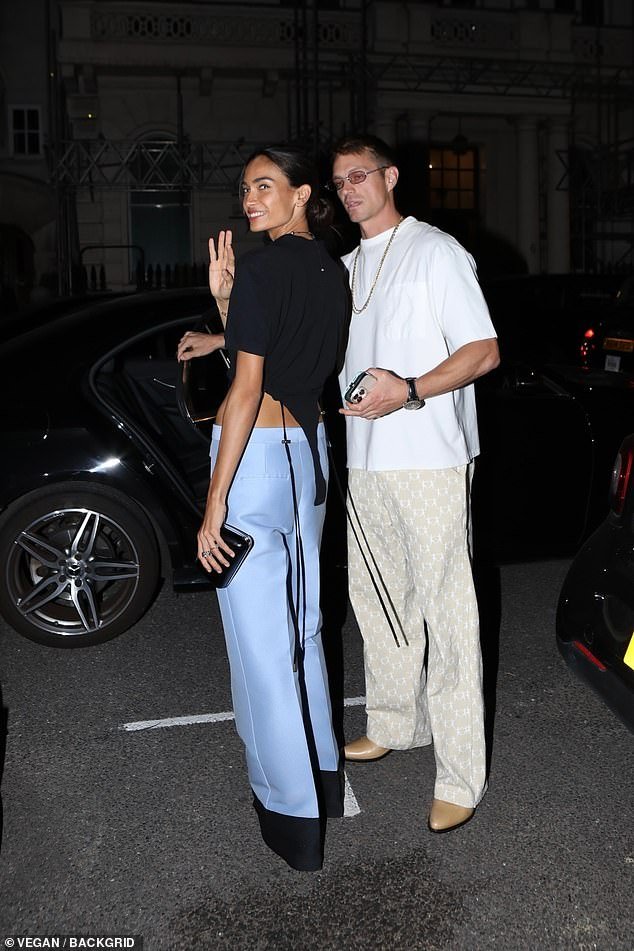 The Victoria's Secret model, 28, was casually chic as she held hands with her husband during a relaxing night out in the British city