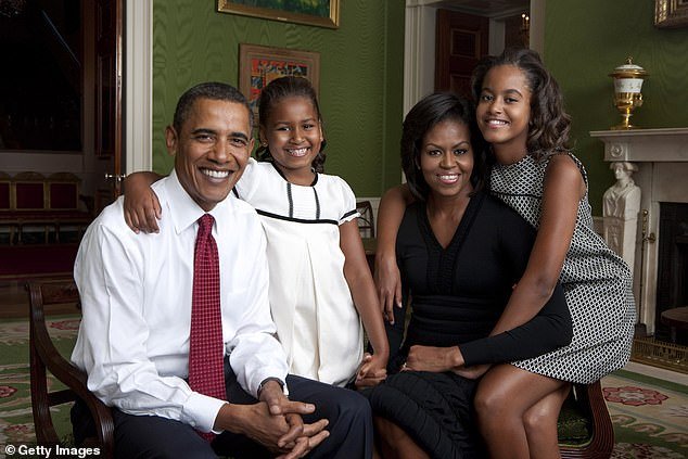 President Barack Obama at the start of his term in the White House with daughter Malia Obama, first lady Michelle Obama and daughter Sasha Obama in the Green Room of the White House September 1, 2009 - Malia was 10 and Sasha was seven when their father became president was chosen