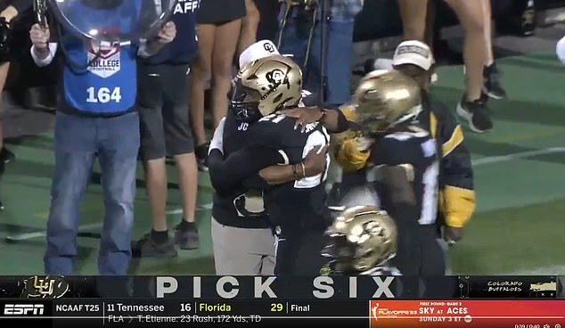 The 23-year-old then hugged his father and coach Deion on the sidelines to celebrate