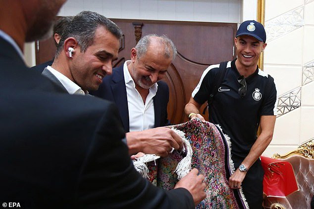 The Portuguese star seemed delighted when he received a Persian carpet from Persepolis as a gift
