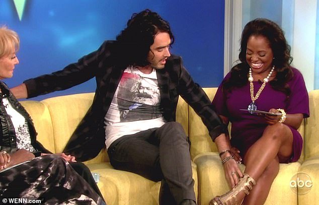 The long-haired star caressed Sherri's bare leg as co-host Barbara Walters looked on