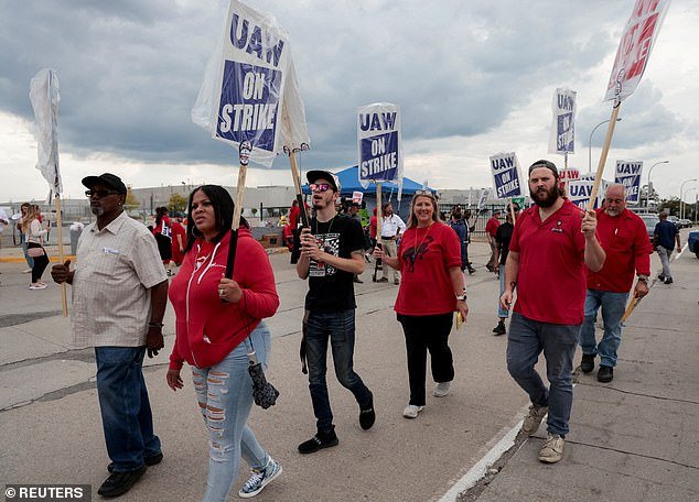 Striking auto workers picket outside the Ford plant in Wayne, Michigan, as 600 workers were laid off after the first day of strike