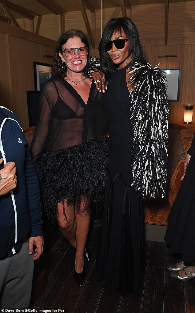 Fashion queens!  Naomi looked stunning in a statement jacket and kept her dark sunglasses on despite the nighttime hour