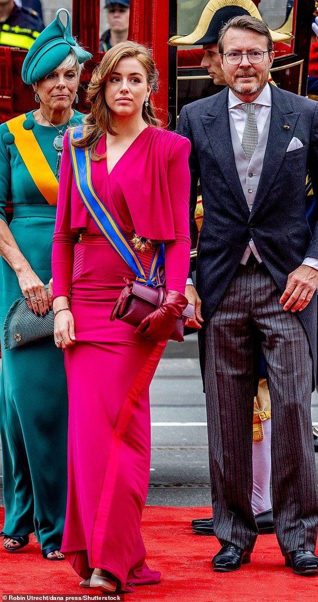 The Dutch king and queen's youngest daughter, Princess Alexia, 18, wore a striking bright pink dress for the annual occasion - flanked by King Willem-Alexander's younger brother, Prince Constantijn and his wife Princess Laurentien