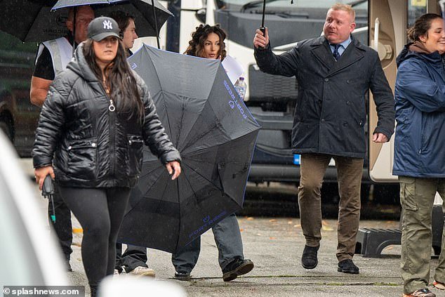 Throwaway: The actress, 36, stars as Erin Croft in the hit comedy and as production on the festive special kicked off, she was seen being covered by at least six umbrellas of