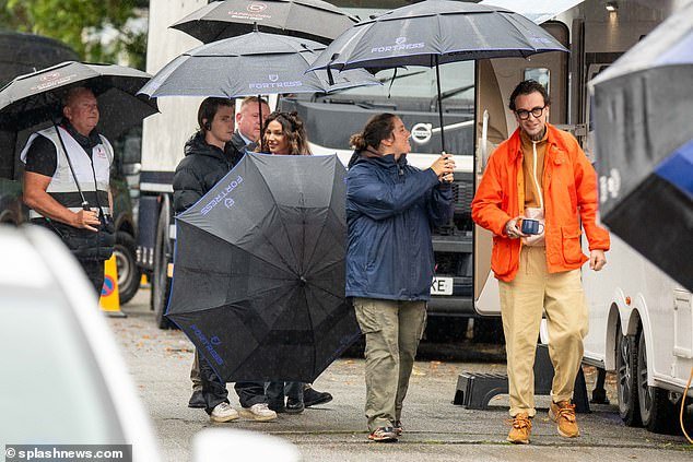 Warm and dry!  The actress had to stay out of the wet weather on set