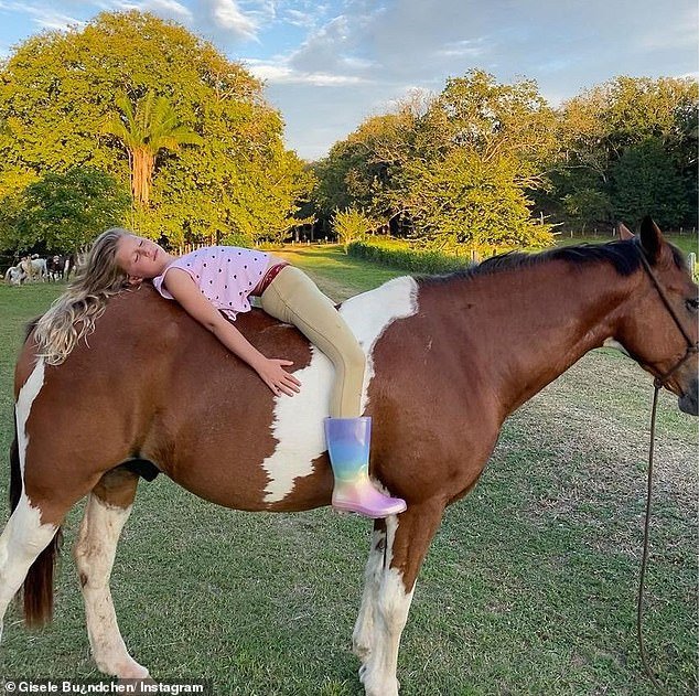 Horse riding: Vivian seen lying on her horse and she is wearing rain boots