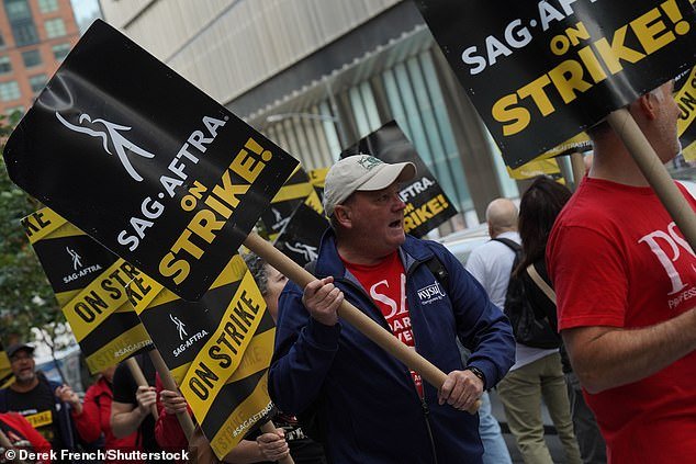 SAG-AFTRA members are joined by the PSA union outside the offices of Netflix and HBO in Hudson Yards, New York.