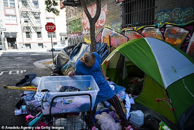 A homeless woman is seen in San Francisco's Tenderloin District