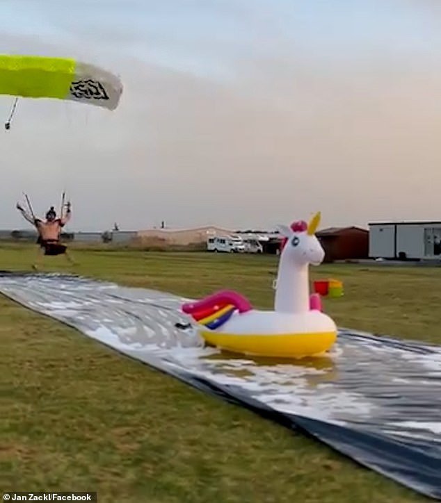 Jan, skydiving instructor, was the only one who managed to land directly on the bouncy castle