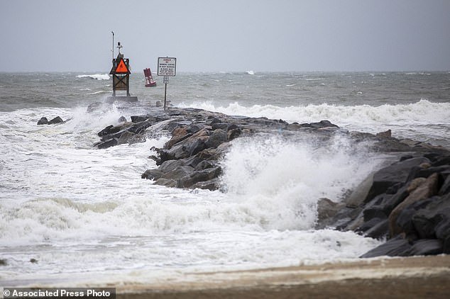 Waves crash along the jetty at Rudee Inlet in Virginia Beach, Virginia, on September 22 as Tropical Storm Ophelia approached the area