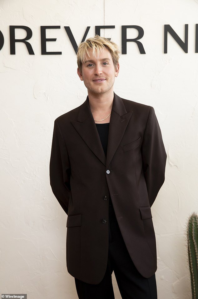 Finally, fashion stylist Elliot Garnaut (pictured) kept it simple, in a dark brown suit over a black T-shirt