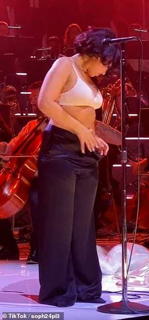 Stripping: The singer, 25, was on stage for a live album recording when she started taking off her clothes during a performance of her hit Body Dysmorphia