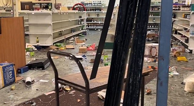 Fine Wine And Good Spirits was vandalized during a looting on the second night