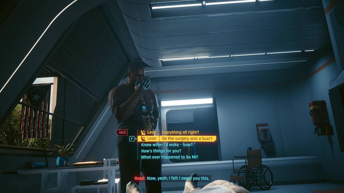 Solomon Reed stands next to V in a hospital bed during the Cyberpunk 2077 Phantom Liberty bonus ending.