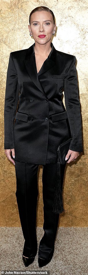 Slim: The actress, who recently attended an event for Prada during Milan Fashion Week, wore a chic double-breasted satin jacket that hugged her slim waist