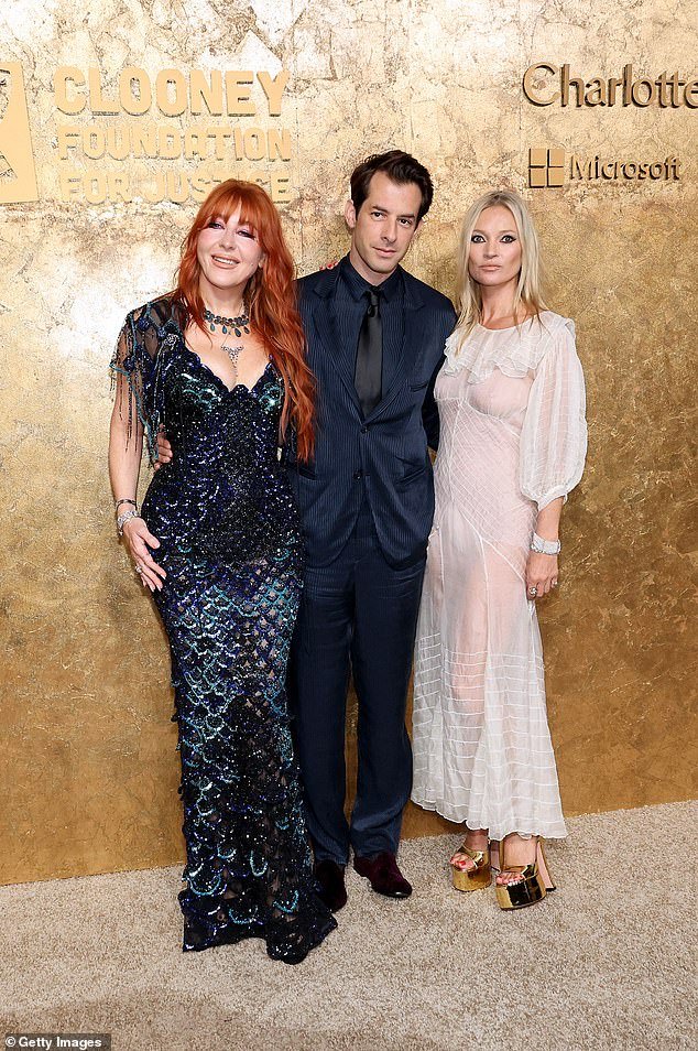 Chic threesome: At one point, Moss took a group photo with makeup mogul Charlotte Tilbury and producer Mark Ronson