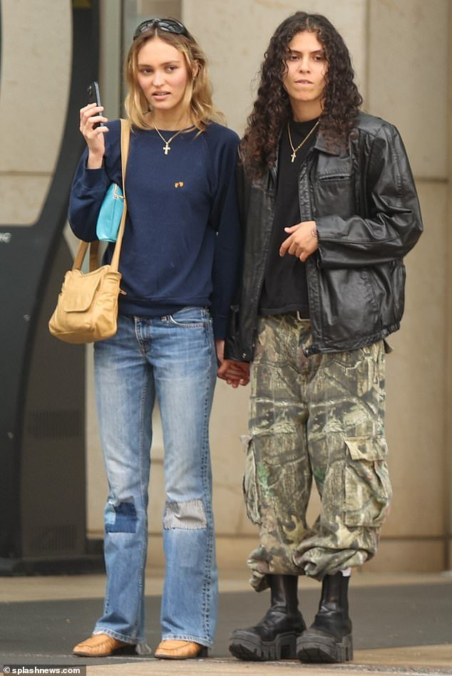 Fashionistas: The Tusk star was effortlessly chic in a sweater and jeans as the duo held hands
