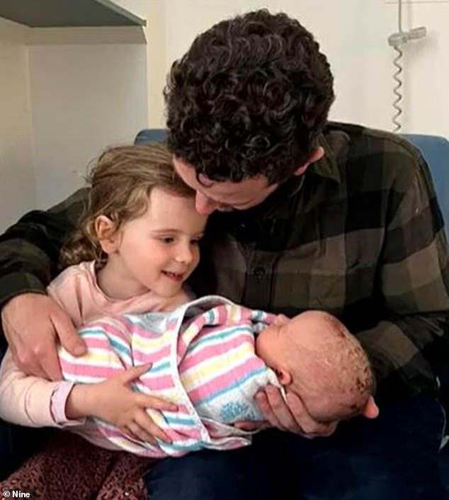 Greg (pictured with his two daughters) was shocked when he was fined while in the hospital delivery room for baby Hazel's birth